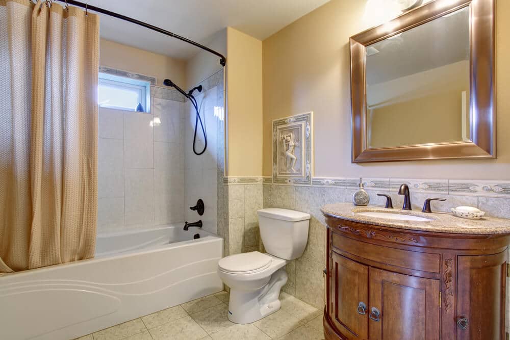 Gorgeous bathroom with tan shower curtain - Big Easy Bathrooms